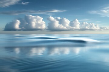 Serene ocean scene with clouds reflecting on calm water.