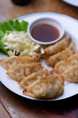 Japanese fried gyoza dumplings with soy sauce