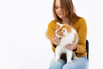 Cozy Moments Woman Cuddling a Sweet Cat in a Bright and Cheerful Setting Filled with Light