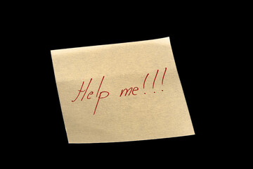 Yellow adhesive paper, similar to a Post-it note, on a black background with the words “I Love you” and three exclamation marks handwritten in green ink.