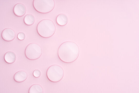 Soft pink background with droplets creates soothing texture