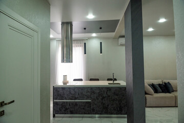 The kitchen is very bright with a modern design.