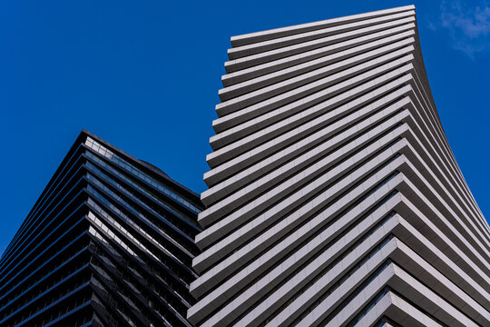 Bold modern architecture with contrasting building designs - Powered by Adobe