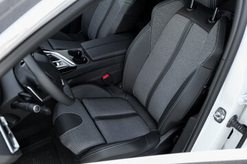 Comfortable seats inside of modern white car, closeup