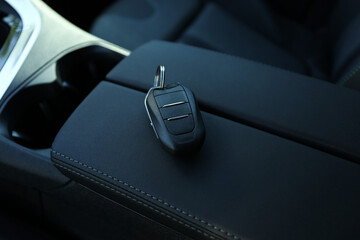 Car flip key inside of modern automobile, closeup