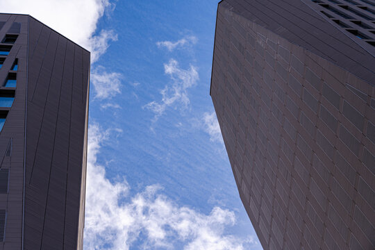 Geometric silhouette of modern buildings against a clear sky