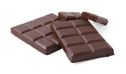 Pieces of delicious dark chocolate bar isolated on white