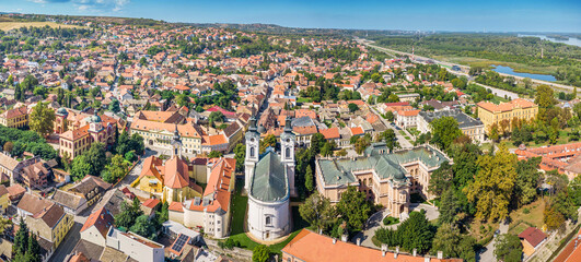 A panoramic aerial view of Sremski Karlovci highlights the stunning summer landscape, with its...