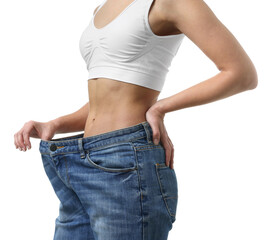 Weight loss. Woman wearing big jeans on white background, closeup