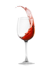 Rose wine splashing in glass on white background