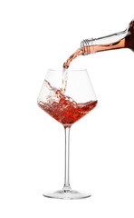 Pouring wine into glass on white background