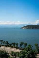 Coastal road and sea under blue sky