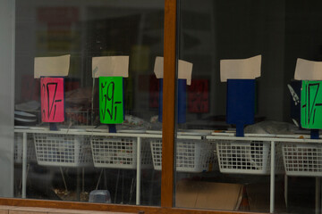 A captivating display of uniquely numbered signs on various baskets can be clearly viewed through...