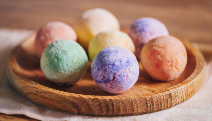 Colorful handmade round powdery bath fizzers. Toiletry item. Self care and spa concept.