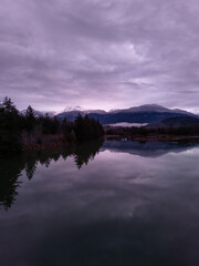 Serene Winter Sunrise Over a Calm Lake in Squamish, BC, Canada