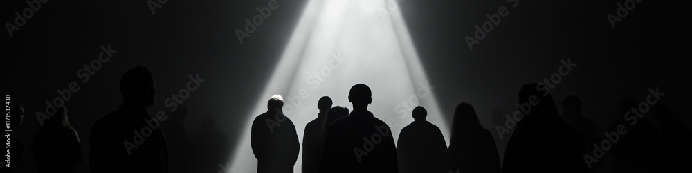 Poster a group of people are standing in front of a light that is shining on them. the light is creating a 