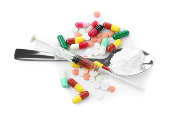 Drug addiction. Different pills, spoon with powder and syringe isolated on white, top view