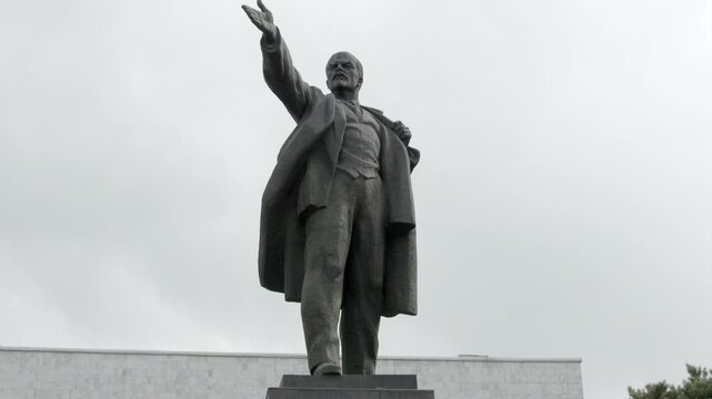 Upward tilt shot of the statue of Vladimir Lenin in Bishkek, Kyrgyzstan.