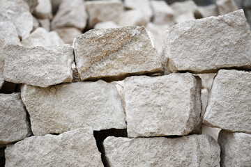 Limestone crushed stone pile in open-pit quarry.