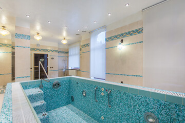 Beautiful design of the room with a swimming pool and entrance to the sauna. Pool bowl with...