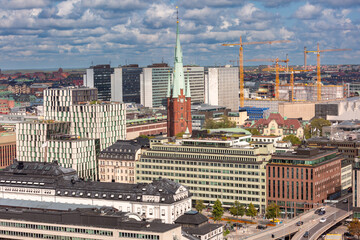 Detailed view of Stockholm cityscape with St. Clara's Church surrounded by modern architecture