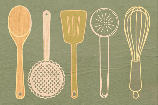 Wooden and metal kitchen utensils on a green background.