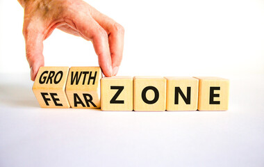 Growth or fear zone symbol. Concept words Growth zone Fear zone on wooden cubes. Beautiful white table white background. Psychologist hand. Business and growth or fear zone concept. Copy space.