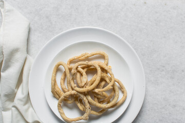 Top view of fried corn rings snack, Overhead view of nigerian kokoro egba corn snack