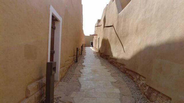 A camera moves down the stret in At-Turaif UNESCO World Heritage Site, Ad-Diriyah, Saudi Arabia