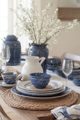 Elegant table setting with blue crockery and spring blossoms