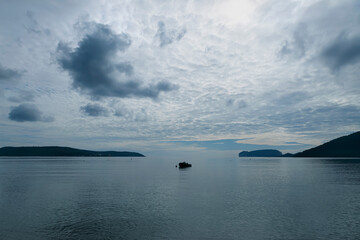 Seascape, relaxing coastline and dramatic clouds, Alghero, Sardinia