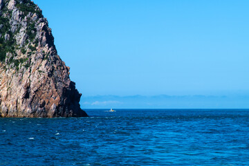 fishing boat and cliff at the seaside