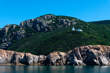 Fototapeta premium lighthouse on the hill at the seaside