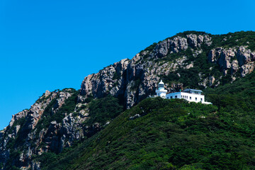 lighthouse on the hill at the seaside