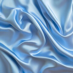 Obraz premium Soft blue fabric background with flowing waves in a smooth, satin texture