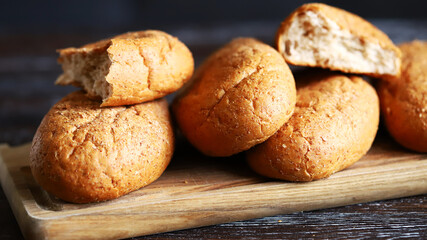 Fresh bran buns on a board