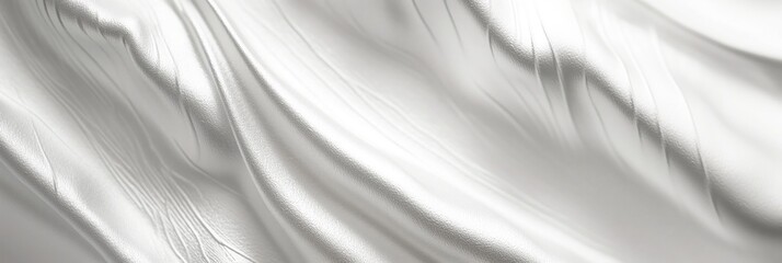 Obraz premium flowing wave of glossy white fabric with soft folds in minimal composition and open copyspace concept of marketing branding advertising