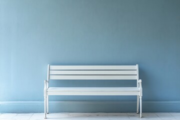 Empty white bench in a minimalist composition. against the background of the wall