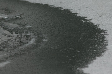 Frozen Water Surface in Winter. A close-up view of a frozen water surface background, showcasing intricate ice patterns and textures formed during winter. Winter backgrounds.