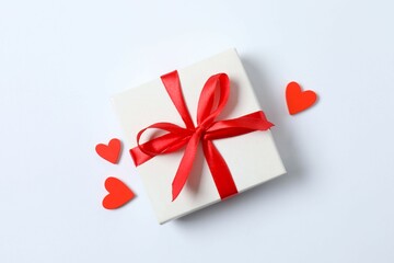 Beautiful gift boxes with red hearts on white background