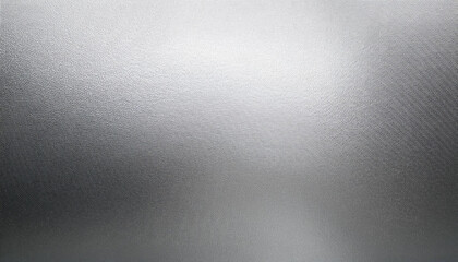 bright grainy metallic silver gradient aluminum foil texture abstract blurred monochrome background with blank space