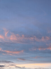 Fototapeta premium Soft pastel clouds at dusk create a serene sky