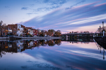 Cityscape of Seneca Falls, New York along the Cayuga and Seneca Canal at dusk.