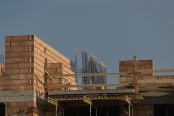 Construction Site on a Sunny Frosty Winter Day. Blend of nature and industry. Construction site bathed in bright sunlight on a frosty winter day.