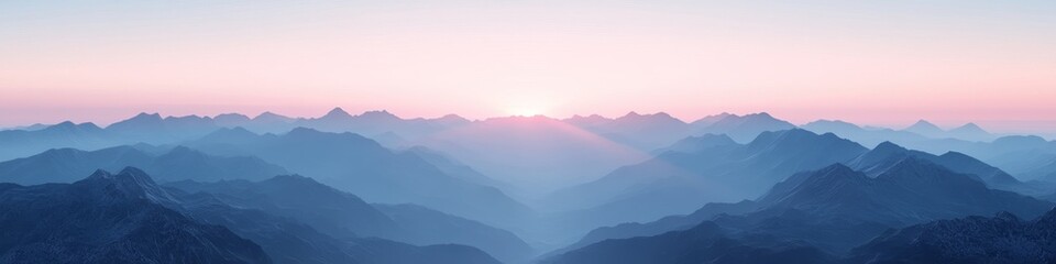 Obraz premium Serene mountain landscape at sunrise, showcasing vibrant colors and layered peaks.