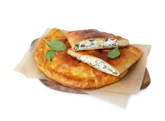 Tasty calzones with cheese and basil isolated on white