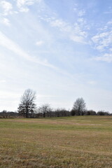 Fototapeta premium Clouds Over a Farm Field