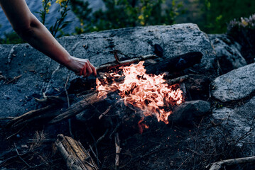 Campfire at tourist campsite, hiking tourism on weekend vacation, fire flame