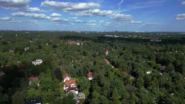 residential district green forest cloudy sky. Dramatic aerial view flight drone