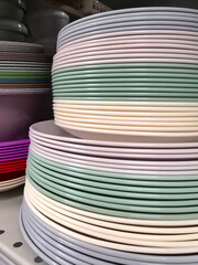 Colorful ceramic plates stacked neatly in a shop display